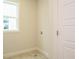 Bright laundry room featuring tile floors, neutral paint, and ample space at 1225 Barreto Drive Dr, Wendell, NC 27591