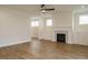 Inviting living room featuring a fireplace, built-in cabinets, and luxury vinyl plank flooring at 1225 Barreto Drive Dr, Wendell, NC 27591
