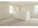 Loft with neutral carpeting and natural light from large windows at 1225 Barreto Drive Dr, Wendell, NC 27591
