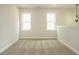Upstairs loft with neutral carpeting and ample natural light at 1225 Barreto Drive Dr, Wendell, NC 27591