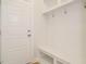 Mud room with built-in bench, storage and white wainscoting at 1225 Barreto Drive Dr, Wendell, NC 27591