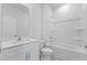 All white bathroom with shower and bath tub, modern vanity, toilet and light gray flooring at 140 Baker Farm Dr, Youngsville, NC 27596