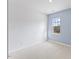 Neutral bedroom with a window that lets in plenty of natural light and a blue accent wall at 140 Baker Farm Dr, Youngsville, NC 27596