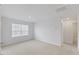 Carpeted bedroom with a window and an entrance to what may be a walk in closet at 140 Baker Farm Dr, Youngsville, NC 27596