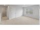Spacious carpeted bedroom with a large window and a walk in closet with great lighting at 140 Baker Farm Dr, Youngsville, NC 27596