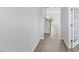 Bright hallway with wood floors, staircase and paneled door with glass inset at 140 Baker Farm Dr, Youngsville, NC 27596