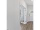 Hallway featuring a paneled glass door and view of the entrance at 140 Baker Farm Dr, Youngsville, NC 27596