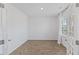 Bright office space with French doors, wood floors, and a large window at 140 Baker Farm Dr, Youngsville, NC 27596