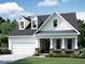 Charming single-Gathering home featuring a two-car garage, covered porch, and dormer windows at 1421 Sparkling Lake Dr # 61, Apex, NC 27523