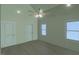 Bedroom with wood floors, ceiling fan and 2 double hung windows at 148 Mohawk Dr, Louisburg, NC 27549