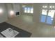 Open floor plan with fireplace, hardwood floors, many windows and modern lighting at 148 Mohawk Dr, Louisburg, NC 27549
