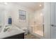 Clean bathroom featuring a glass shower and double sink vanity at 1600 Frog Hollow Way, Wake Forest, NC 27587