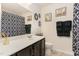 Bathroom with dark cabinets, white countertop, and a decorative black and white shower curtain at 1600 Frog Hollow Way, Wake Forest, NC 27587