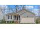 Charming single-story home with a two-car garage and landscaped front yard at 1600 Frog Hollow Way, Wake Forest, NC 27587