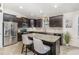Modern kitchen boasts stainless steel appliances, granite countertops, and dark wood cabinets at 1600 Frog Hollow Way, Wake Forest, NC 27587