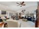 Inviting living room with comfortable seating, a ceiling fan, and plenty of natural light at 1600 Frog Hollow Way, Wake Forest, NC 27587