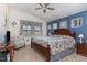 Main bedroom with blue accent wall, vaulted ceiling, and natural light at 1600 Frog Hollow Way, Wake Forest, NC 27587