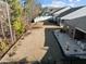 A spacious backyard with a deck and mature trees, offering ample space for outdoor living and recreation at 1713 Wrenn Rd, Durham, NC 27703