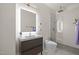 Modern bathroom with a floating vanity, illuminated mirror, and a glass-enclosed walk-in shower at 1713 Wrenn Rd, Durham, NC 27703