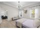 Inviting bedroom with plenty of natural light, neutral tones, and a comfortable bed at 1713 Wrenn Rd, Durham, NC 27703