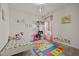 Playful bedroom with colorful decor, a cozy bed, and playful ABC learning mat at 1713 Wrenn Rd, Durham, NC 27703