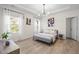 Bright bedroom with large windows, modern lighting, and neutral decor at 1713 Wrenn Rd, Durham, NC 27703
