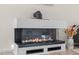 Modern fireplace with a glass enclosure and decorative stones, providing a cozy focal point at 1713 Wrenn Rd, Durham, NC 27703