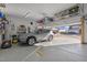 Attached garage with epoxy floor and overhead storage racks, showcasing a parked SUV at 1713 Wrenn Rd, Durham, NC 27703