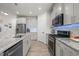 Well-equipped kitchen featuring granite countertops, stainless steel appliances, and stylish cabinetry at 1713 Wrenn Rd, Durham, NC 27703