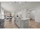 Open kitchen featuring an island with sink and views of the dining and living room at 1713 Wrenn Rd, Durham, NC 27703
