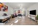 Spacious living room featuring a fireplace, comfortable seating, and access to the outdoors at 1713 Wrenn Rd, Durham, NC 27703