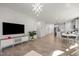 Open-concept living and dining area with modern lighting and a seamless flow to the kitchen at 1713 Wrenn Rd, Durham, NC 27703