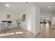 Open office space with hardwood flooring, desk, and a view into the Gathering room at 1713 Wrenn Rd, Durham, NC 27703