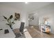 Office with hardwood floors, desk, chair, shelving, and a view into the hallway at 1713 Wrenn Rd, Durham, NC 27703