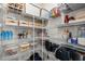 Organized pantry with wire shelving, containing various food items and storage containers at 1713 Wrenn Rd, Durham, NC 27703