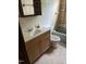 This bathroom features a vanity, toilet, green tub, and patterned tile at 186 Frank Cash Rd, Timberlake, NC 27583