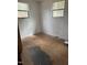 Simple bedroom with natural light from two windows and potential for creating a personalized space at 186 Frank Cash Rd, Timberlake, NC 27583