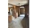 Compact kitchen area needing renovation, featuring wood paneling and basic fixtures at 186 Frank Cash Rd, Timberlake, NC 27583