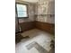 Shows significant damage in empty room with missing floors, damaged walls and broken trim at 186 Frank Cash Rd, Timberlake, NC 27583