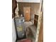 The utility room features a water heater and plywood walls at 186 Frank Cash Rd, Timberlake, NC 27583