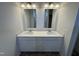 Bathroom featuring double sinks, a large vanity, and two mirrors at 192 Bruce Dr, Dunn, NC 28334