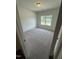 Bright bedroom features plush carpeting and a window providing natural light at 192 Bruce Dr, Dunn, NC 28334