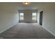Bedroom featuring plush carpeting and two windows offering natural light at 192 Bruce Dr, Dunn, NC 28334