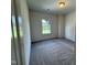 Bright bedroom featuring a window, neutral walls and plush, clean carpeting at 192 Bruce Dr, Dunn, NC 28334