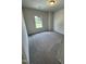 Bright bedroom features plush carpeting and a window providing natural light at 192 Bruce Dr, Dunn, NC 28334
