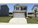 Charming two-story home featuring a two-car garage and well-manicured lawn at 192 Bruce Dr, Dunn, NC 28334