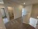 Hallway looking towards the stairs with laundry room and bedrooms on the upper level at 192 Bruce Dr, Dunn, NC 28334