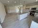 Open concept kitchen with granite countertops, stainless appliances, and white cabinets at 192 Bruce Dr, Dunn, NC 28334