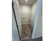 Modest laundry room with tile flooring and built in shelving, ready for appliances at 192 Bruce Dr, Dunn, NC 28334