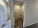 Laundry room with washer and dryer hookups and wire shelving at 192 Bruce Dr, Dunn, NC 28334